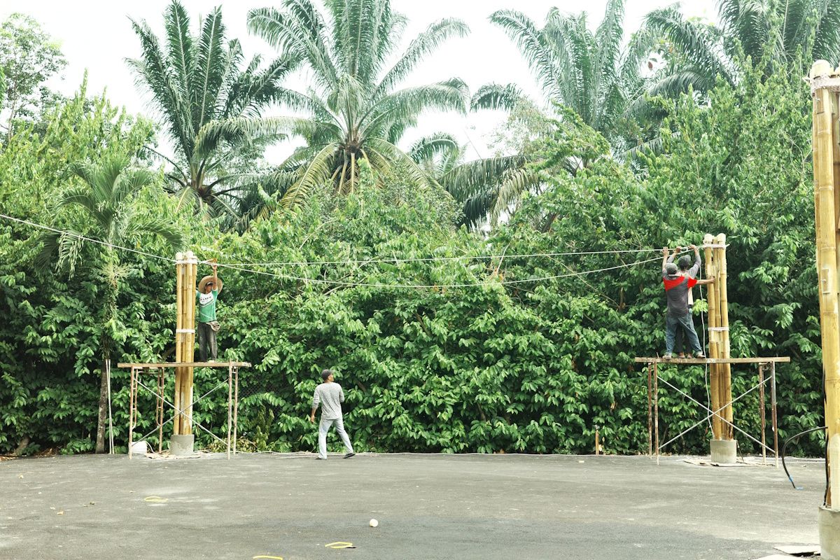 DEK team installing bamboo columns
